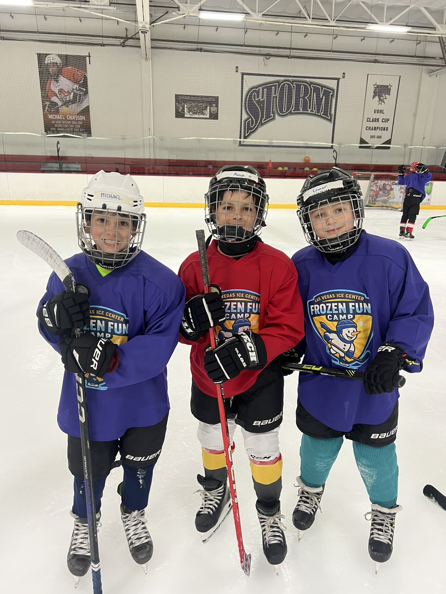 Three young players on the ice